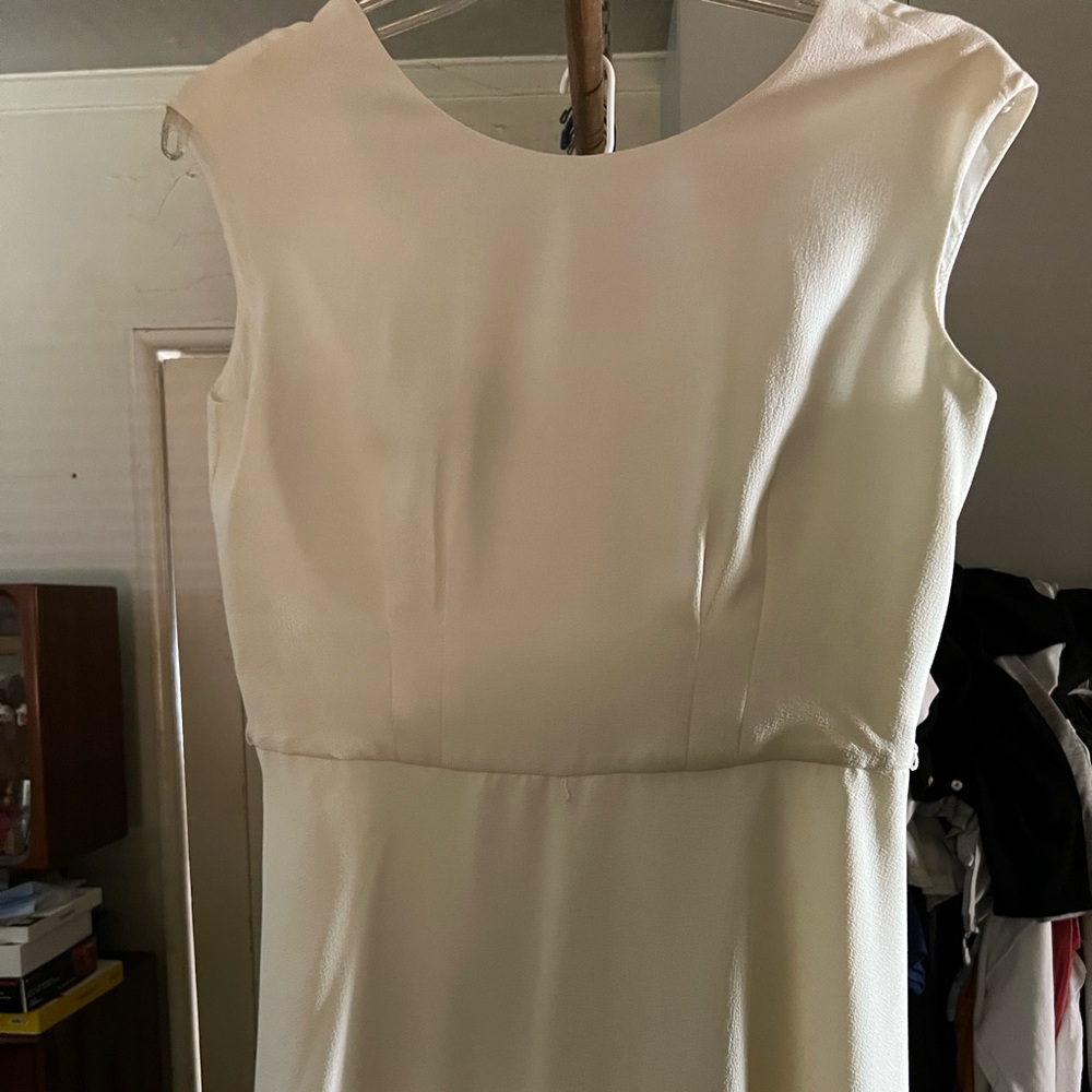 Vintage white dress with no sleeves. Bought new and worned once.